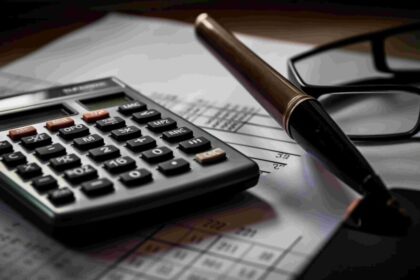 calculator glasses sit top piece paper 1024x585